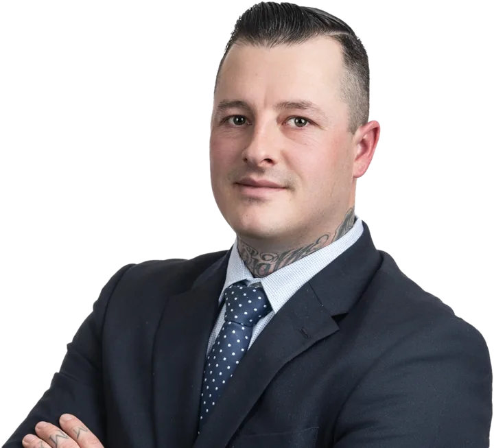 Nick McMullin, REALTOR®, in a navy suit